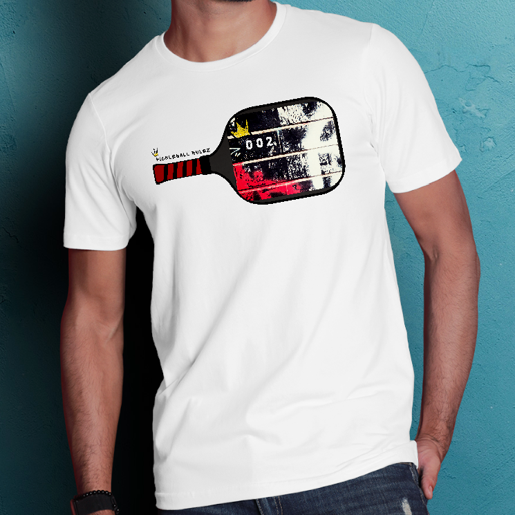 Man wearing a white t-shirt with a graphic design against a textured blue wall