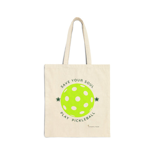Beige tote bag with a green pickleball graphic and text on a white background