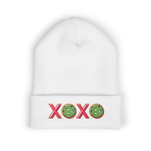 White beanie with 'XOXO' design on a white background