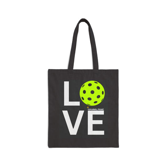 Black tote bag with a green polka dot ball and 'LOVE' text on a white background