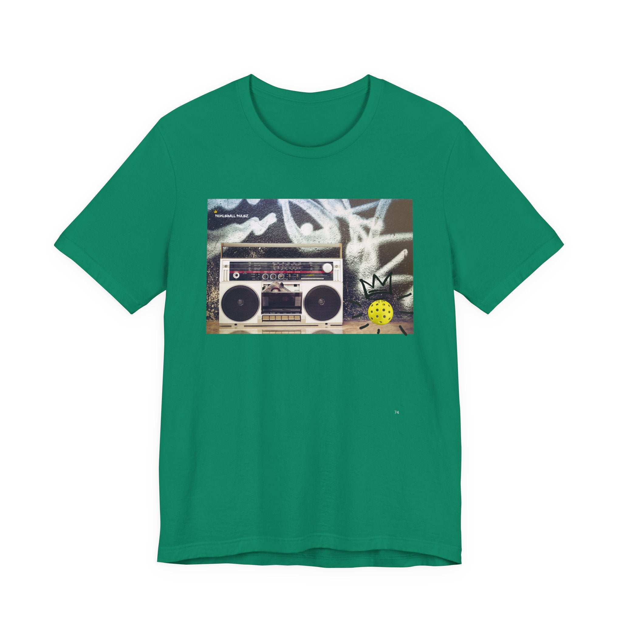 Green t-shirt with a graphic of a boombox and cassette tape on a white background