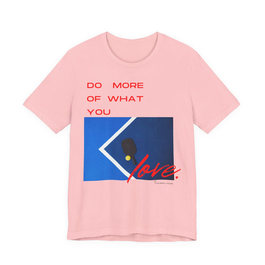 Pink t-shirt with motivational quote and graphic design on a white background