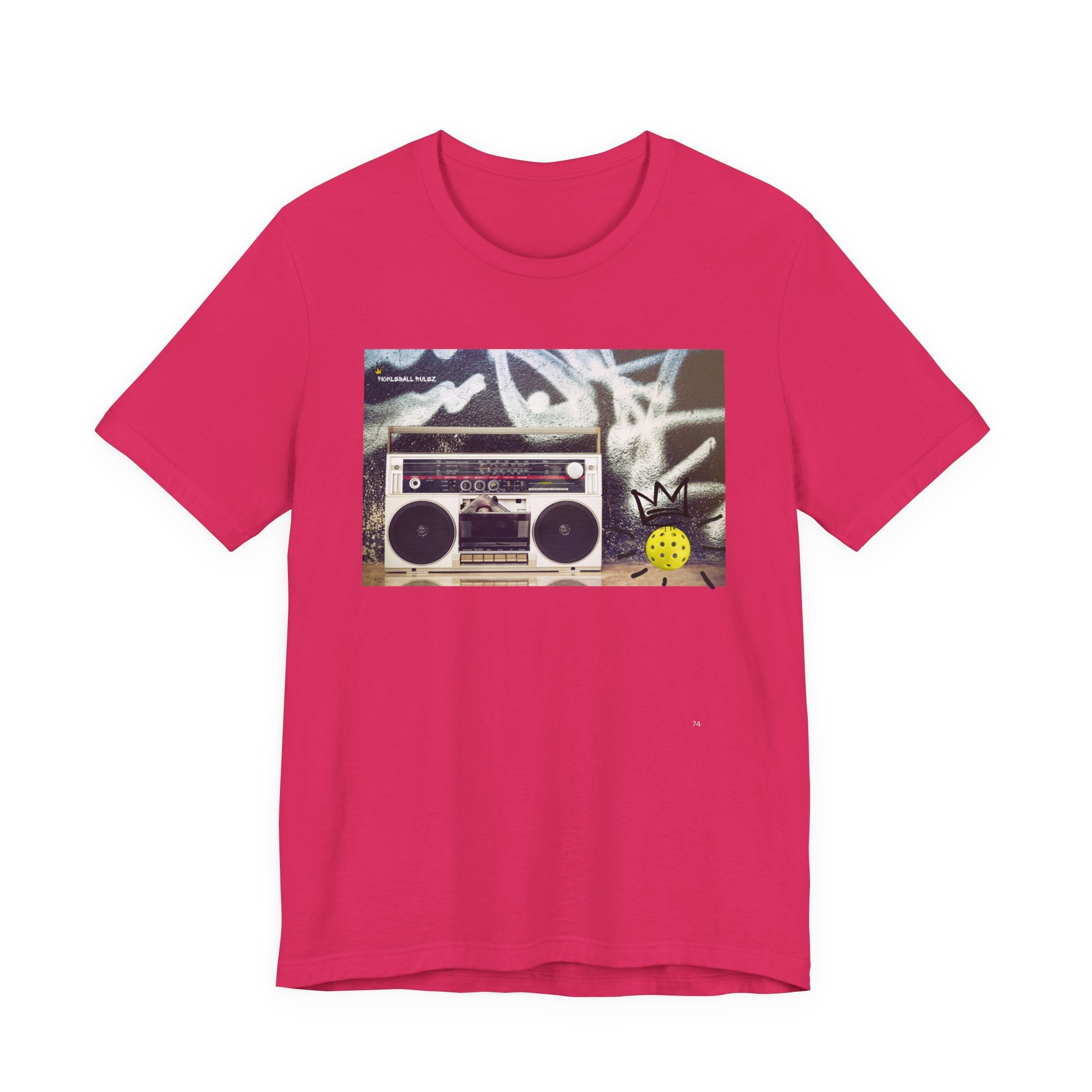 Pink t-shirt with a graphic of a boombox on a white background
