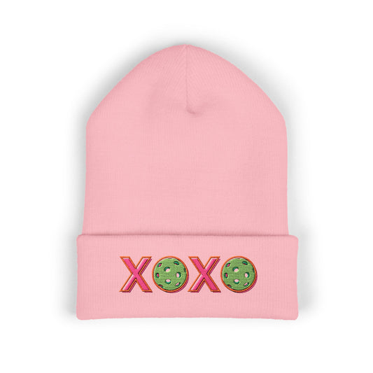 Pink beanie with 'XOXO' and cookie designs on a white background