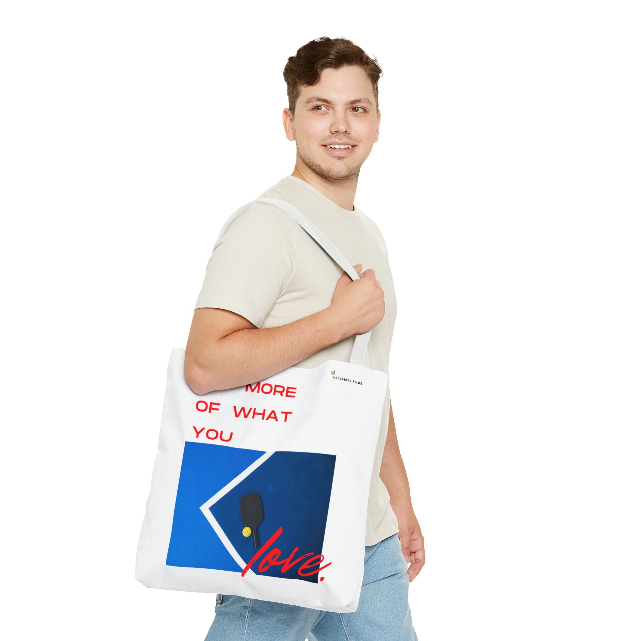 Man holding a tote bag with a design and text on a white background