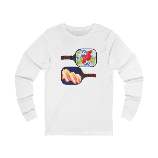 White long-sleeve shirt with colorful pickleball paddle designs on a white background