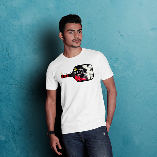 Man wearing a white t-shirt with a graphic design against a textured blue wall