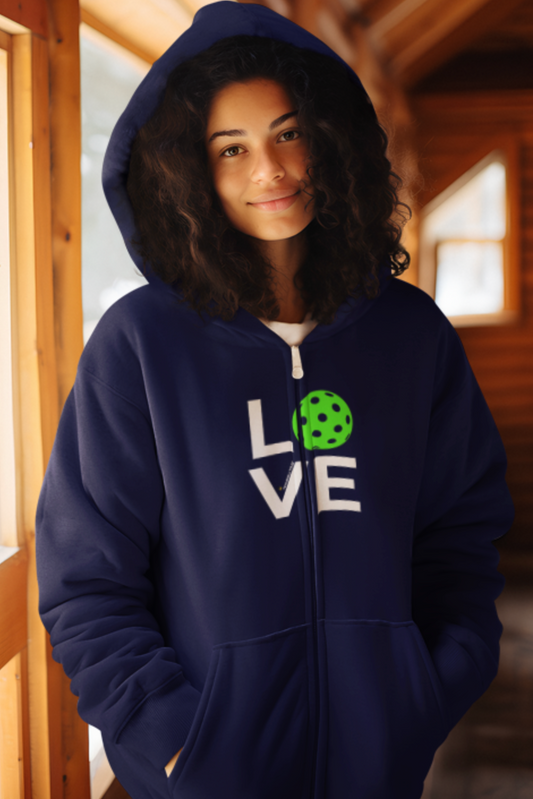 Person wearing a navy blue hoodie with 'LOVE' printed on it, standing indoors.