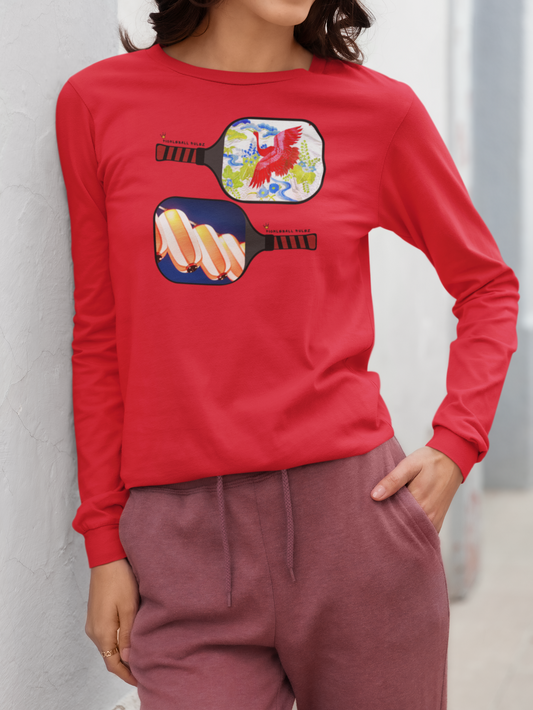 Person wearing a red long-sleeve shirt with colorful pickleball paddle design against a light gray background