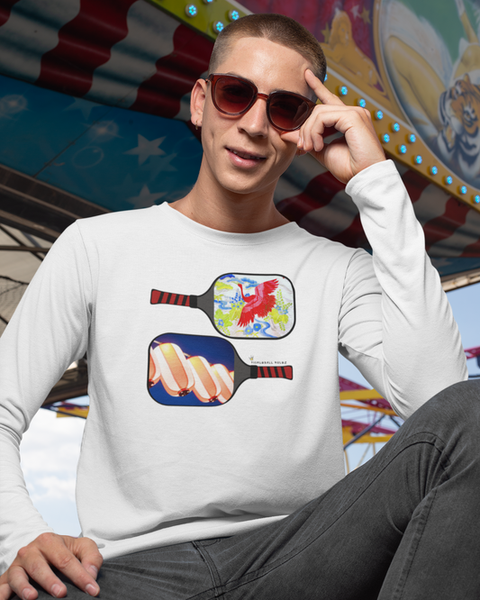 Person wearing a white sweatshirt with colorful paddle design in front of a carnival ride.