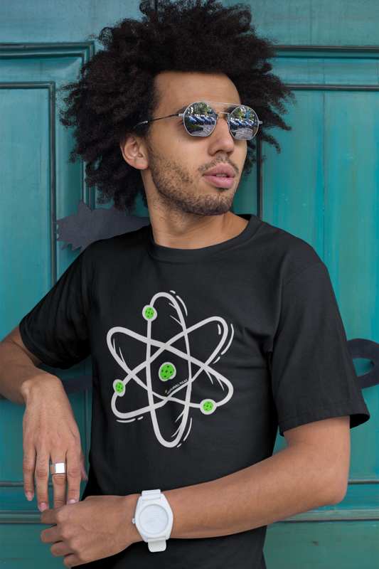 Man wearing a black t-shirt with an atom design in front of a teal door.
