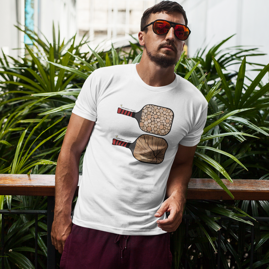 Man wearing a white t-shirt with paddle design outdoors