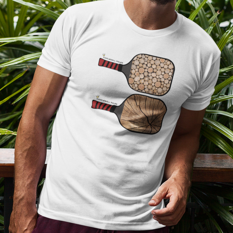 Man wearing a white t-shirt with paddle design outdoors