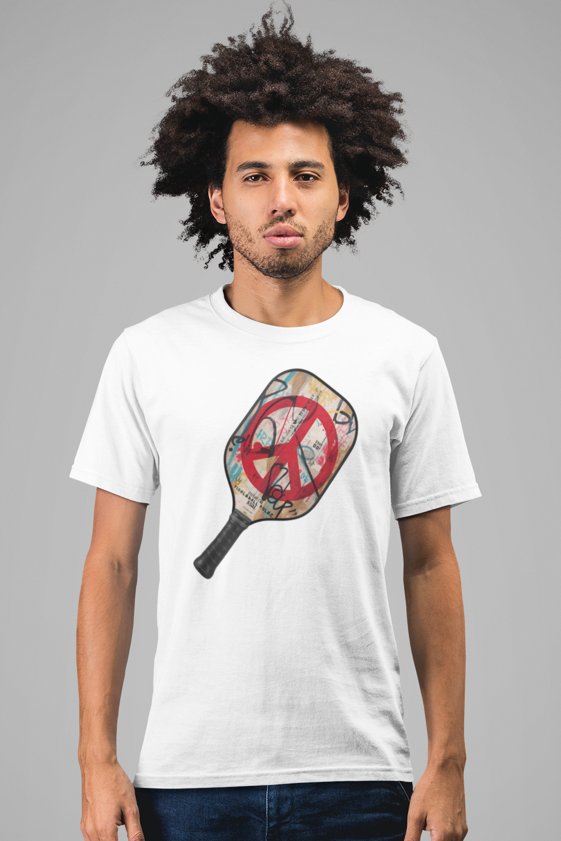 Man wearing a white t-shirt with a graphic design on a gray background