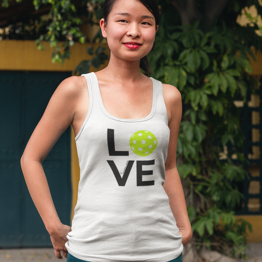 Woman wearing a white tank top with 'LOVE' and a pickleball ball design.